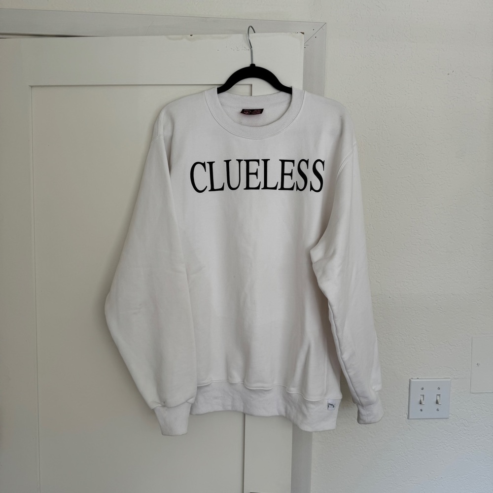 “CLUELESS” sweatshirt by Praying